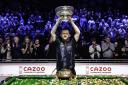 Mark Allen lifts the Champion of Champions trophy in front of the packed Bolton crowd. Picture by Matchroom Multi Sport