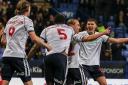 Kyle Dempsey celebrates scoring Bolton's sixth goal against Exeter City