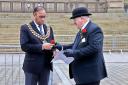 Cllr John Walsh hands a red rose to Mayor of Bolton, Cllr Mohammed Ayub to commemorate Lancashire DayPhotos by Henry Lisowski
