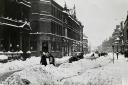 Snow piled high on Bradshawgate in Bolton during the winter of 1940