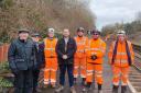 Far left - Stephen Freeborn, Chair of The Friends of Westhoughton Station, with a volunteer from the group with him and Cllr Martin Tighe with rail workers