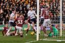 Aaron Collins sees a late shot blocked in front of the Northampton goal
