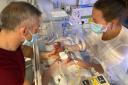 Fintan O’Malley and Becca Neal with Millie in the Royal Bolton Neonatal Intensive Care Unit