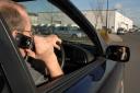 A man on his mobile phone while driving