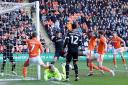 Marvin Ekpieta scores Blackpool's second goal of the day at Bloomfield Road