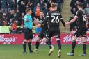 Bolton Wanderers' Gethin Jones reacts as Referee Josh Smith awards a penalty kick