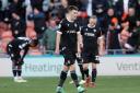 Bolton Wanderers players look dejected after Jordan Lawrence-Gabriel scored Blackpool's fourth goal Picture: CameraSport