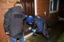 Police raiding the property in Bury