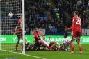 Cameron Jerome forces  Bolton's first goal over the line against Shrewsbury