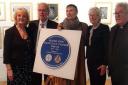 The plaque surrounded by Deputy Lieutenant Anne, husband Reverend Chaplain John and members of the Tanner family