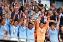 Manchester City's players celebrate after winning last season's FA Cup final