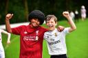 Ayaan Akiff aged 10 and Henry Anderson aged nine as Mo Salah and Christiano Ronaldo ahead of the Champions League final as Bolton School Junior boys take part in their annual charity fancy dress run.