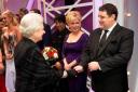 ROYAL APPOINTMENT: Peter Kay meets the Queen as fellow performer Bette Midler looks on