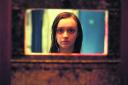 Olivia Cooke has a room with a view in the British horror film The Quiet Ones.