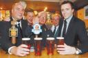 From left, Dave Robson, Steve Kay, Duncan Wright, Cres Robson and Max Flanigan raise a glass of Ronnie’s Reward