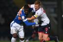 Eoin Doyle grapples for the ball in Wanderers' win at Rochdale