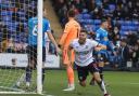Dion Charles celebrates one of his three goals against Peterborough United last season