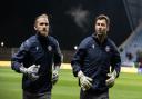 Nathan Baxter right, with Joel Coleman in the warm-up against Oxford United