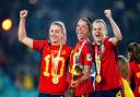 Spain’s Jenni Hermoso, centre, celebrates with team-mates Alexia Putellas, left, and Irene Paredes after winning the FIFA Women’s World Cup (Zac Goodwin/PA)
