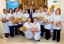 Star attraction: Film star Hugh Grant with Bolton’s Marie Curie nurses at an event in London in July