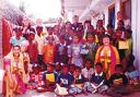 <li> Melanie Price, Betty Price and Rita Varey are pictured with some of the Indian orphans who have benefited from the SunFlowerTrust <li> Betty Price with a young Indian boy <li> The group cross a river during the recent trip to India <li> Rose Roberts