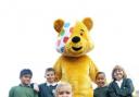CHARITY TRAIL: Pudsey Bear with St Peter C E Primary School pupils, from left, Kashhiup Lalji aged eight, Thomas Hardwick aged nine, Francesca Hayes aged eight, Dominic Lloyd aged eight and Tegan Tyldesley aged nine