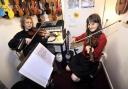 IN TUNE: Violin teacher, Matt Haigh and pupil Sofia Wood, aged 11, from Smithills school, Bolton, practise for the 2009 Christmas concert to raise money for the Marie Curie nurses appeal