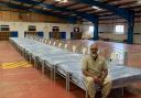 Dr Dr Mohammed Jiva MBE from the Ghosia Mosque with the beds donated to Backup