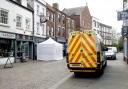 A police tent at the Clean Plate cafe in Gloucester.  May 11, 2021.  Police are today digging under a cafe for the remains of a missing 15-year-old girl feared murdered by serial killer Fred West 53 years ago.  Schoolgirl Mary Bastholm was last seen on 6
