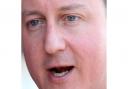 Cameron unveils 'ambitious' plan in manifesto