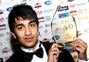 DELIGHTED: Abdul Rahman of Bilal Poultry shows off his Young Entrepreneur of the Year award