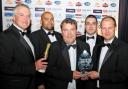THE INNOVATORS: Andrew Roberts, managing director of Pennine Telecom, centre, pictured with staff, and far right, Andy Smith of the University of Bolton which sponsored the award jointly with the Hakim Group