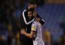 Ian Evatt embraces Dion Charles after his winning goal against Shrewsbury Town