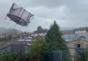 Handout photo taken with permission from the Twitter feed of @john_morgan_wal showing a trampoline flying mid air during Storm Eunice in Builth Wells, mid Wales. Via PA.