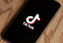 TikTok logo displayed on phone. Credit: PA