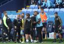 Bolton Wanderers manager Ian Evatt and Sheffield Wednesday manager Darren Moore embrace at the end of the match