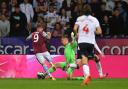 Bolton Wanderers' Joel Dixon fouls Aston Villa's Danny Ings to give away a penalty