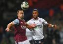 Bolton Wanderers' Elias Kachunga battles with Aston Villa's Calum Chambers