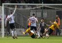 James Trafford makes a stunning late save to preserve a point for Bolton at Cambridge United.
