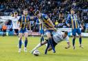 Dion Charles goes down in the penalty box under pressure from Shrewsbury's Tom Flanagan