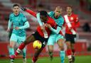 Dan Nlundulu in action for Southampton against Liverpool in the Premier League