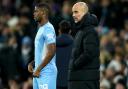 Wanderers' new loan signing Luke Mbete stood with his Manchester City boss Pep Guardiola.