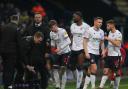 Bolton Wanderers manager Ian Evatt watches his players take a drink during a break in play