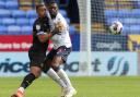 Ricardo Santos battles Jonson Clarke-Harris in Wanderers' 1-0 win against Peterborough in September.