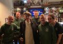 Sir Ian McKellen with staff at The Jolly Farmers pub.