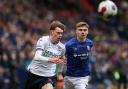 Bolton Wanderers' Conor Bradley chases a pass with Ipswich Town's Leif Davis close by