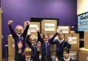 Children at Turton and Edgworth Primary School celebrating their new computers and tablets