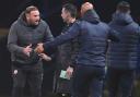 Ian Evatt and Dino Maamria clash on the touchline during Wanderers' 2-1 win against Burton Albion