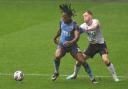Bolton Wanderers' George Johnston battles with Fleetwood Town's Promise Omochere
