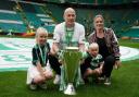 Celtic's Aaron Mooy and family pose with the trophy after the cinch Premiership match at Celtic Park, Glasgow.